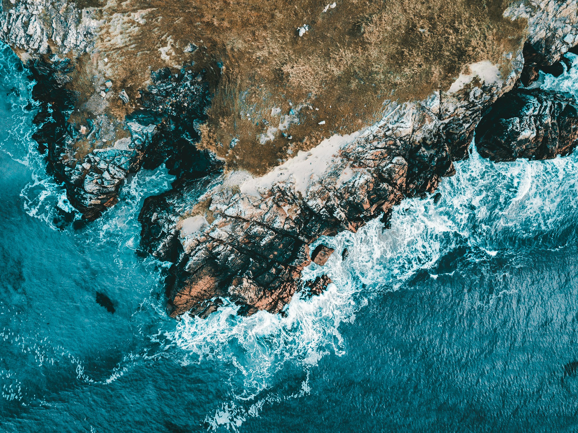 Atlantic waves breaking against the rugged coastline of the Isle of Lewis, photographed by Michael Grant